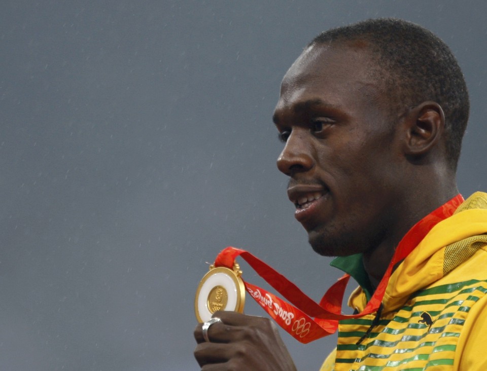 Usain Bolt: 100 e 200 metros rasos com os recordes pulverizados e um físico não tão favorável a ele | Carlos Barria / Reuters
