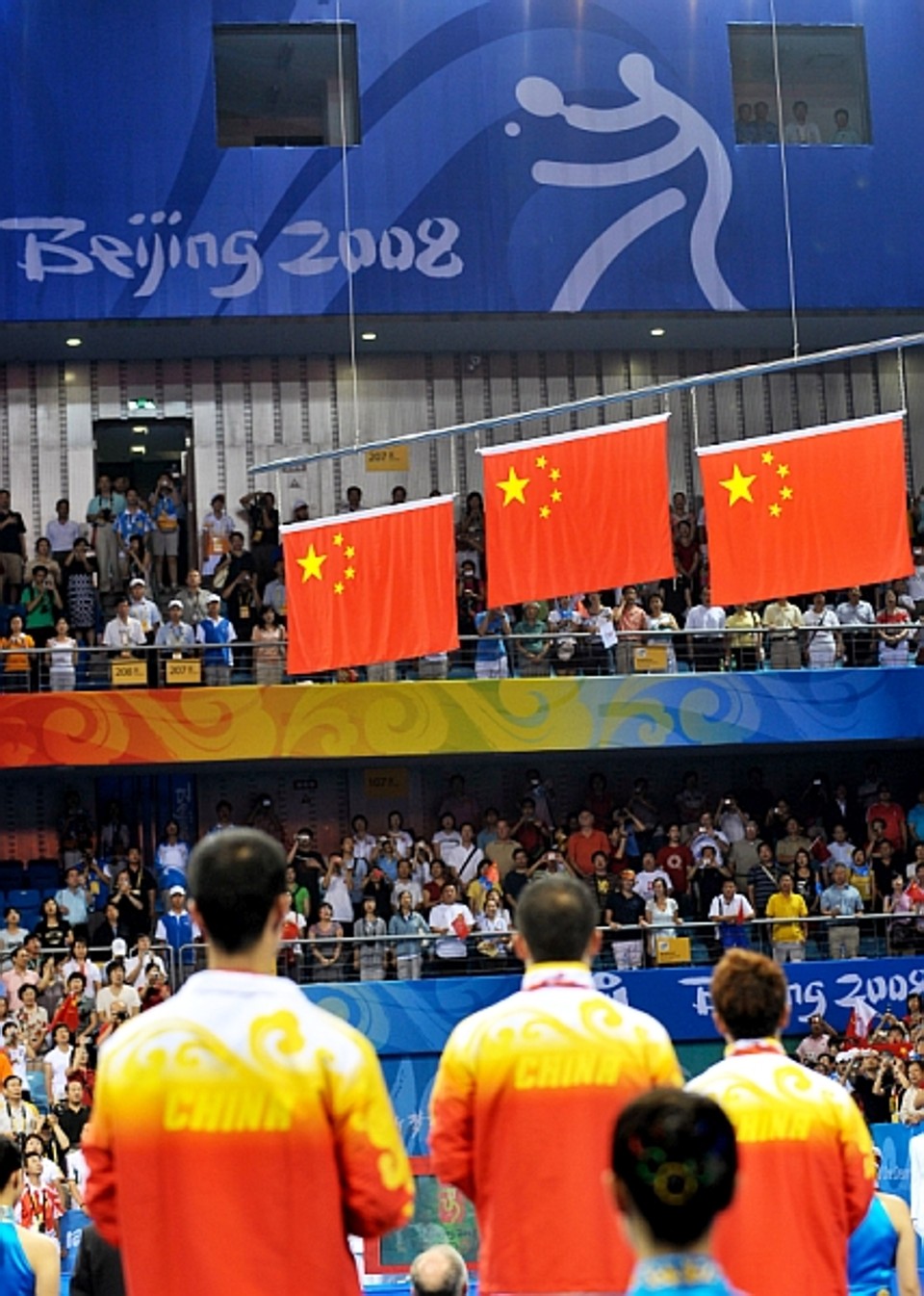 Wang Liqin, Ma Lin e Wang Hao no pódio individual do tênis de mesa, esporte dominado pelos chineses. | Teh Eng Koon/ AFP