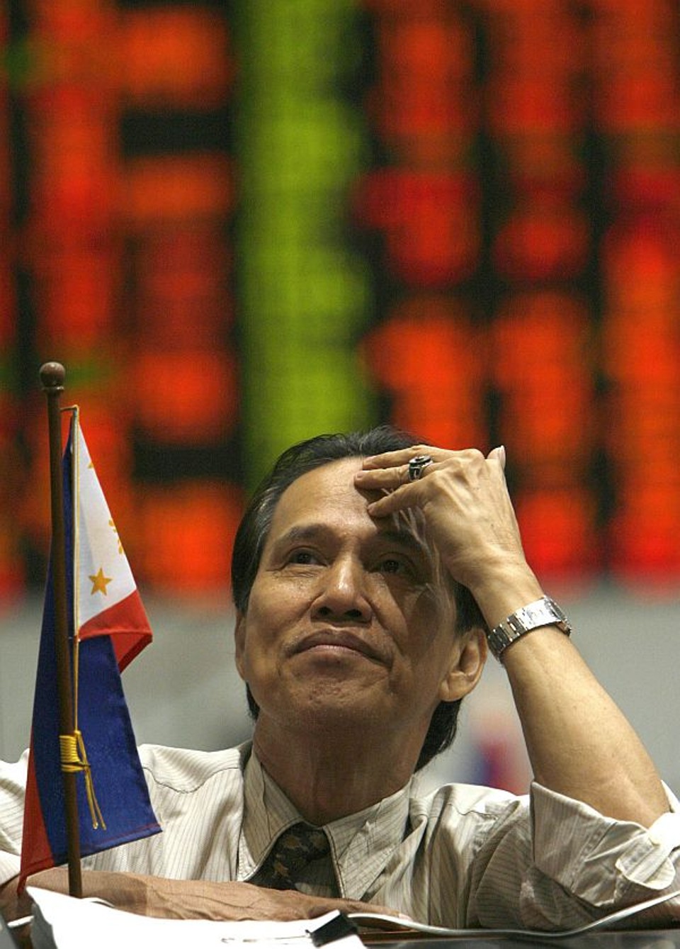 Operador na bolsa de Manila, nas Filipinas: crise afetará economias de todo o mundo. | Cheryl Ravelo/Reuters