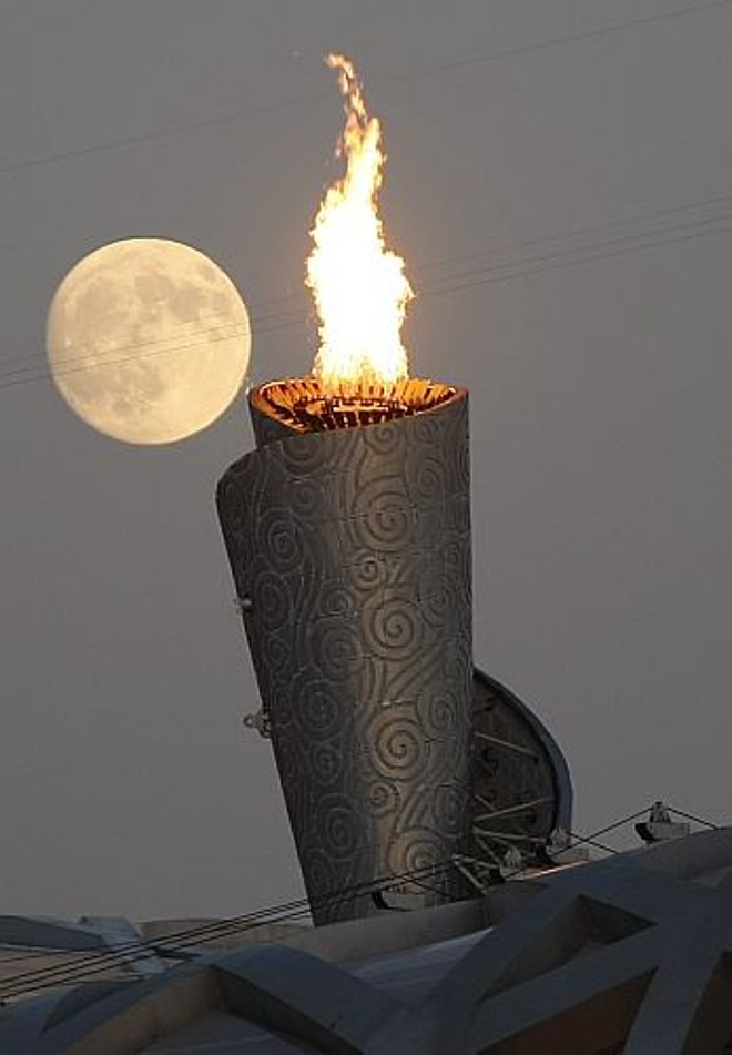 A tocha olímpica na paisagem de Pequim |