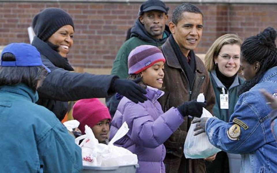 A família Obama. Da esquerda para direita: Michelle, Sasha, Malia e Barack, em evento em Chicago, em 26 de novembro | John Gress/Reuters