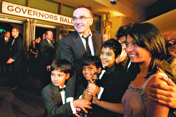 O diretor inglês Danny Boyle e o elenco infantil de "Quem Quer Ser um Milionário?" | Reuters