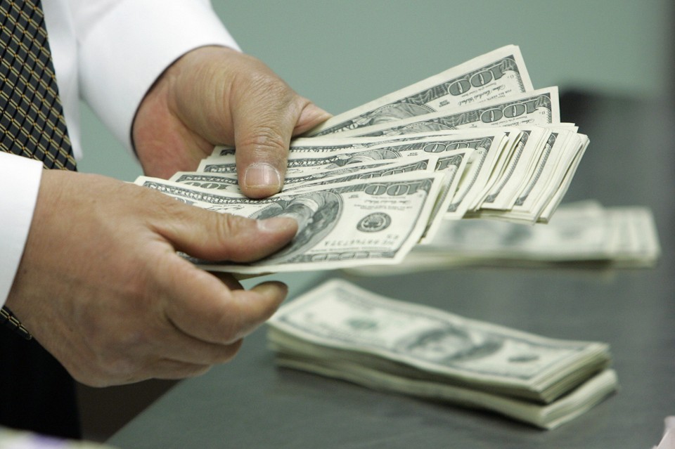 Troca do dólar por nova moeda mundial é | Jo Yong-Hak / Reuters