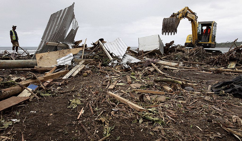 Autoridades afirmam que cidades inteiras podem ter sido destruídas pelo tsunami | Reuters