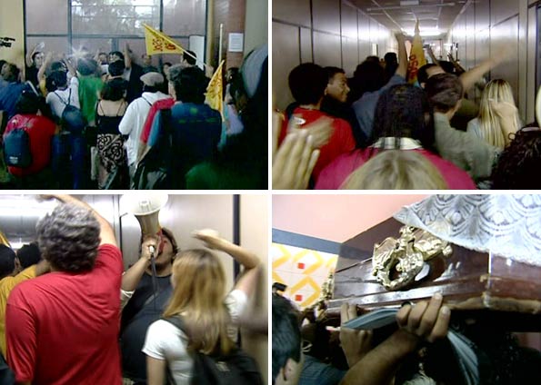 Segurando um caixão, os manifestantes gritavam "O Arruda vai cair, vai cair o Arruda". Eles subiram nas cadeiras e na mesa do plenário e diziam palavras de ordem no microfone, ameaçando prolongar a ocupação | Reprodução / TV Globo