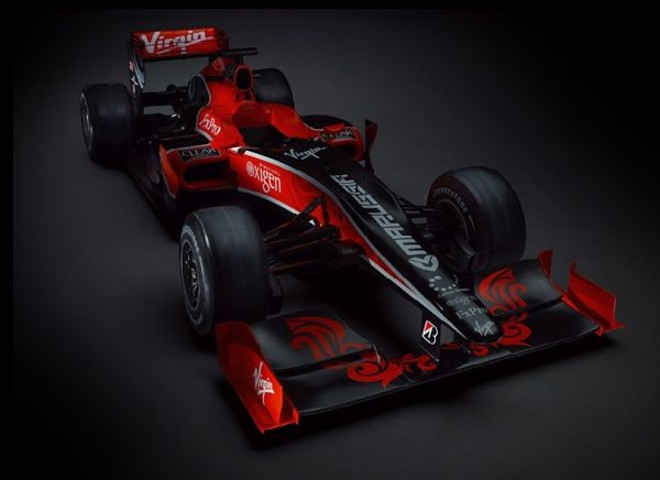 100% virtual -Única estreante a já ter colocado o carro na pista, a Virgin optou por uma entrada totalmente virtual na categoria. O VR-01 foi inteiramente concebido por computador, sem passar por túnel de vento. O lançamento também foi via internet. Agora, a escuderia busca, pelo twitter, facebook e no seu site oficial, frases para os boxes de Timo Glock e Lucas Di Grassi. Algumas opções: Glock and Roll e Lucas in the Sky with Diamonds | IMAGEM DA SEMANA - Divulgação/ Virgin Racing