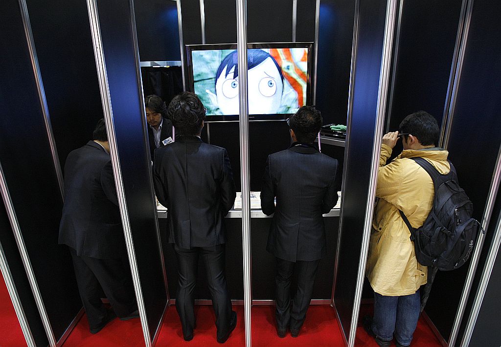 Visitantes assistem desenho 3D em feira de animes de Tóquio | Yuriko Nakao/Reuters