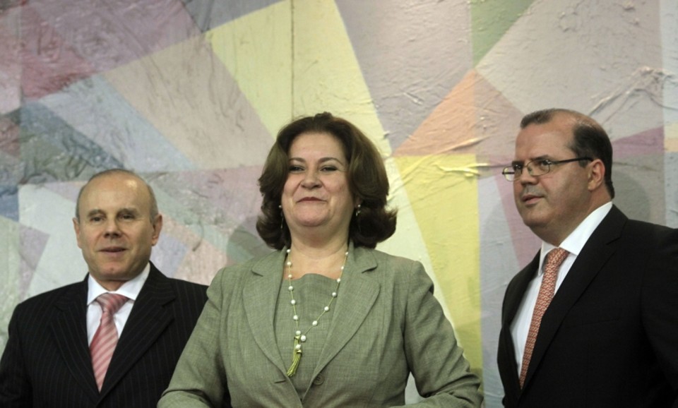 Guido Mantega, Miriam Belchior e Alexandre Tombini: promessa de manter a política de estabilidade econômica | Evaristo Sá/AFP