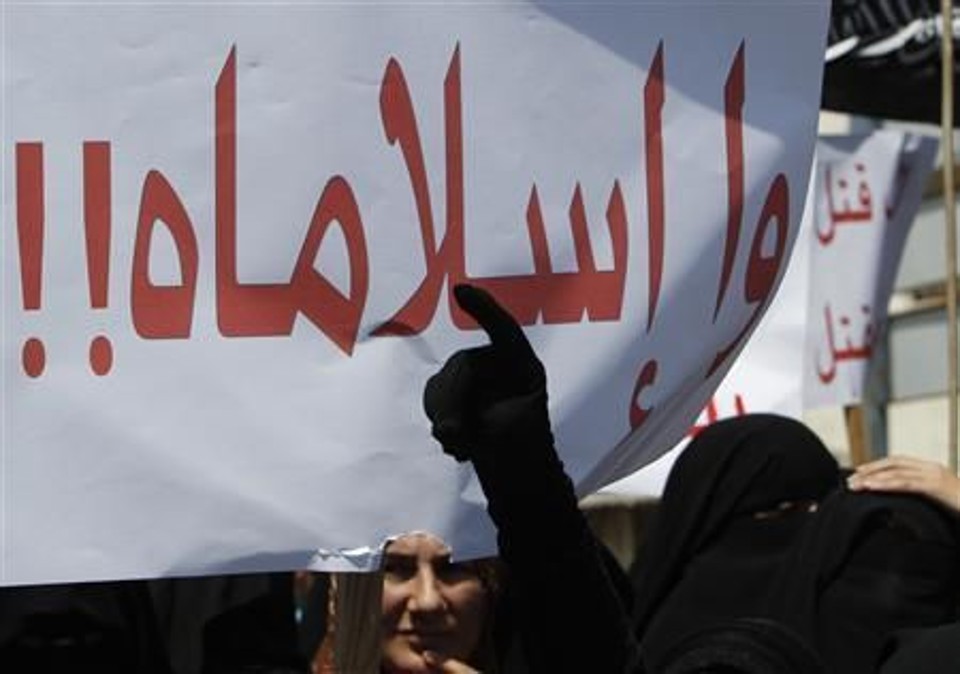 Membro de grupo islâmico sunita Jamaat al-Islamiya fazem protesto contra o presidente da Síria, Bashar al-Assad, em Sidon | Reuters