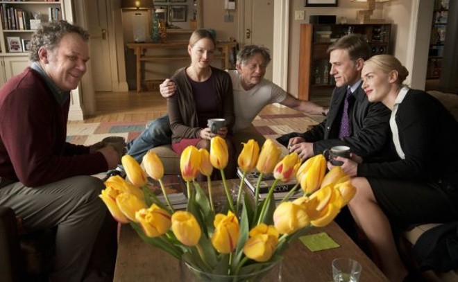 O elenco de Carnage, com Roman Polanski ao fundo: da amabilidade à perversidade |