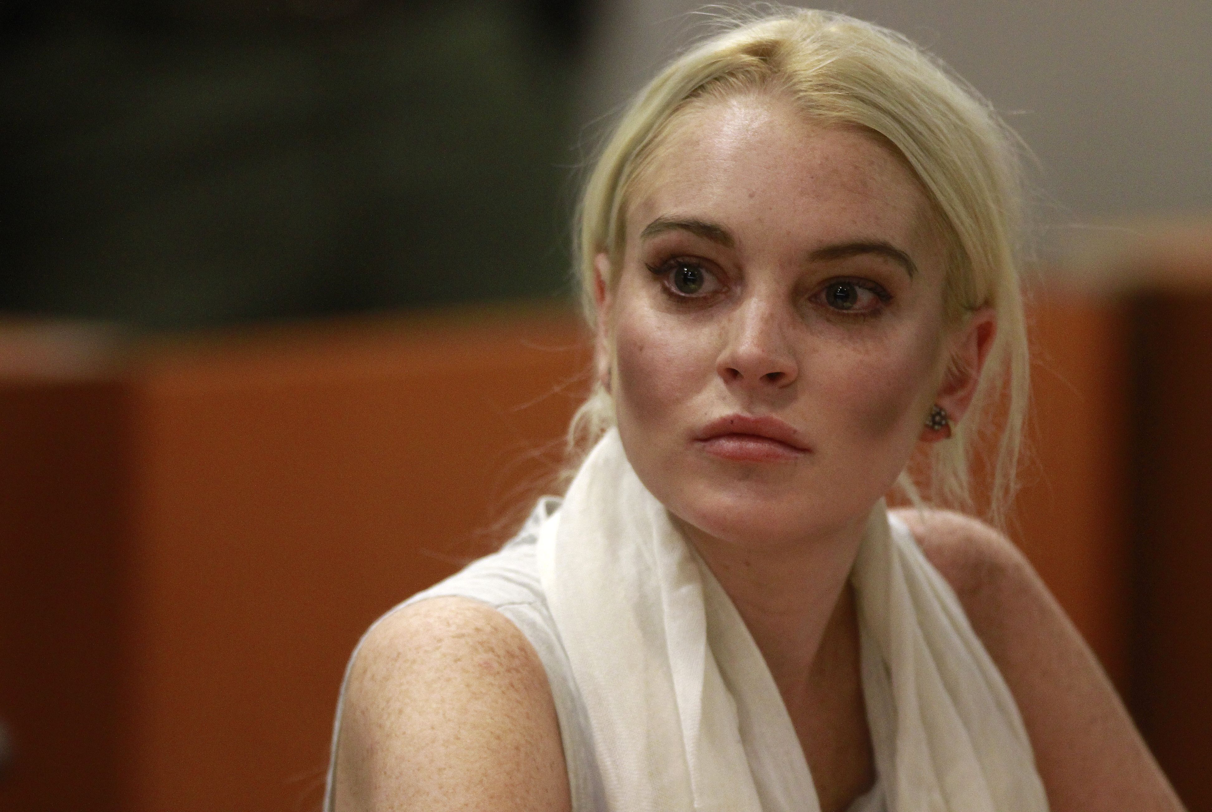 Atriz Lindsay Lohan na Corte em Los Angeles, no dia 19 de outubro deste ano | AFP PHOTO / POOL / Mark Boster