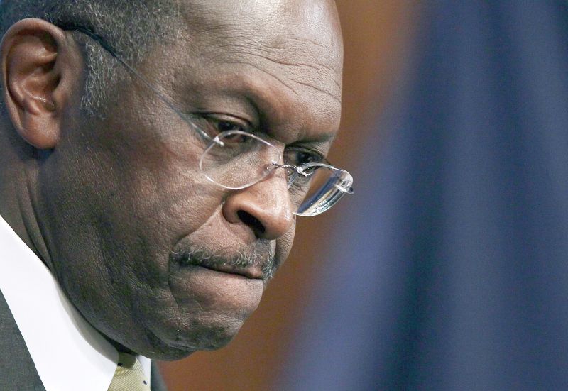 Herman Cain diz sofrer perseguição | Win McNamee/AFP