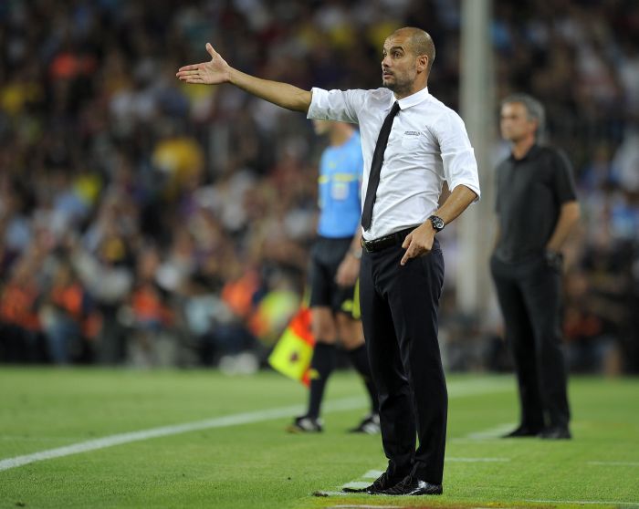 O técnico do Barcelona Josep Guardiola escolheu os 23 jogadores que defenderão o clube no Mundial do Japão | Lluis Gene/ AFP