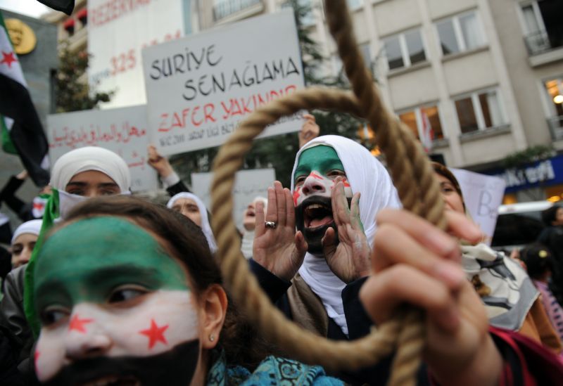 Em Homs, 200 mil pessoas participaram de uma marcha | AFP PHOTO / BULENT KILIC