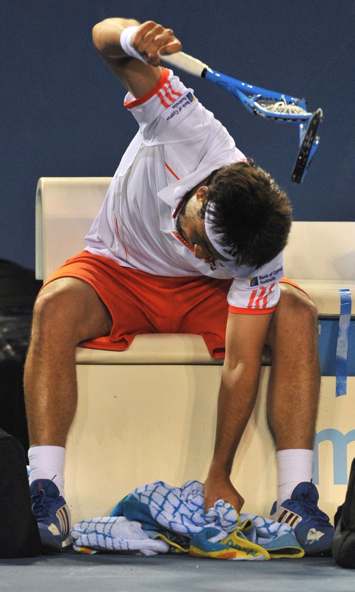 Baghdatis teve ataque de fúria durante a derrota para Wawrinka no Aberto da Austrália | Paul Crock / AFP