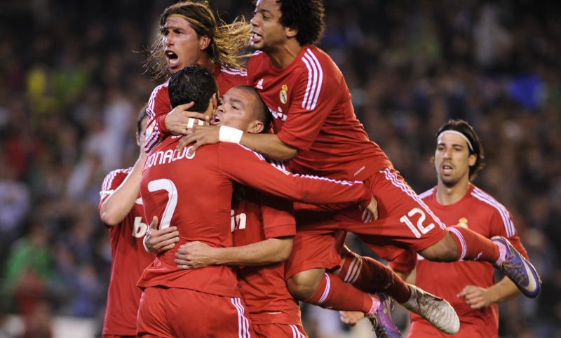 Jogadores do Real comemoram gol com Cristiano Ronaldo | Cristina Quicler/AFP