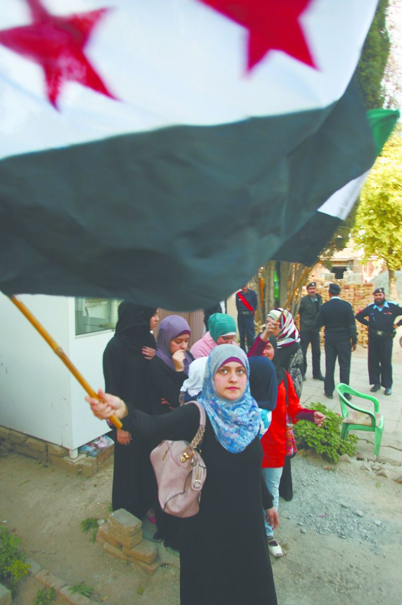 Populares protestam em Damasco | AFP / Farooq Naem