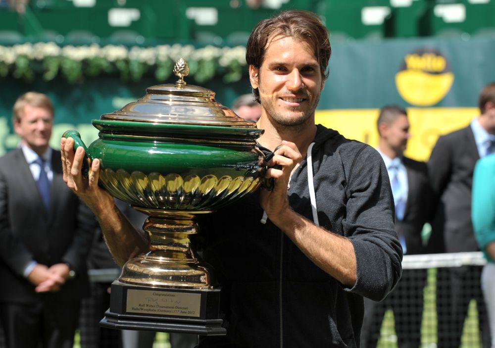 O veterano alemão superou Federer e ficou com o título | Carmen Jaspersen/AFP