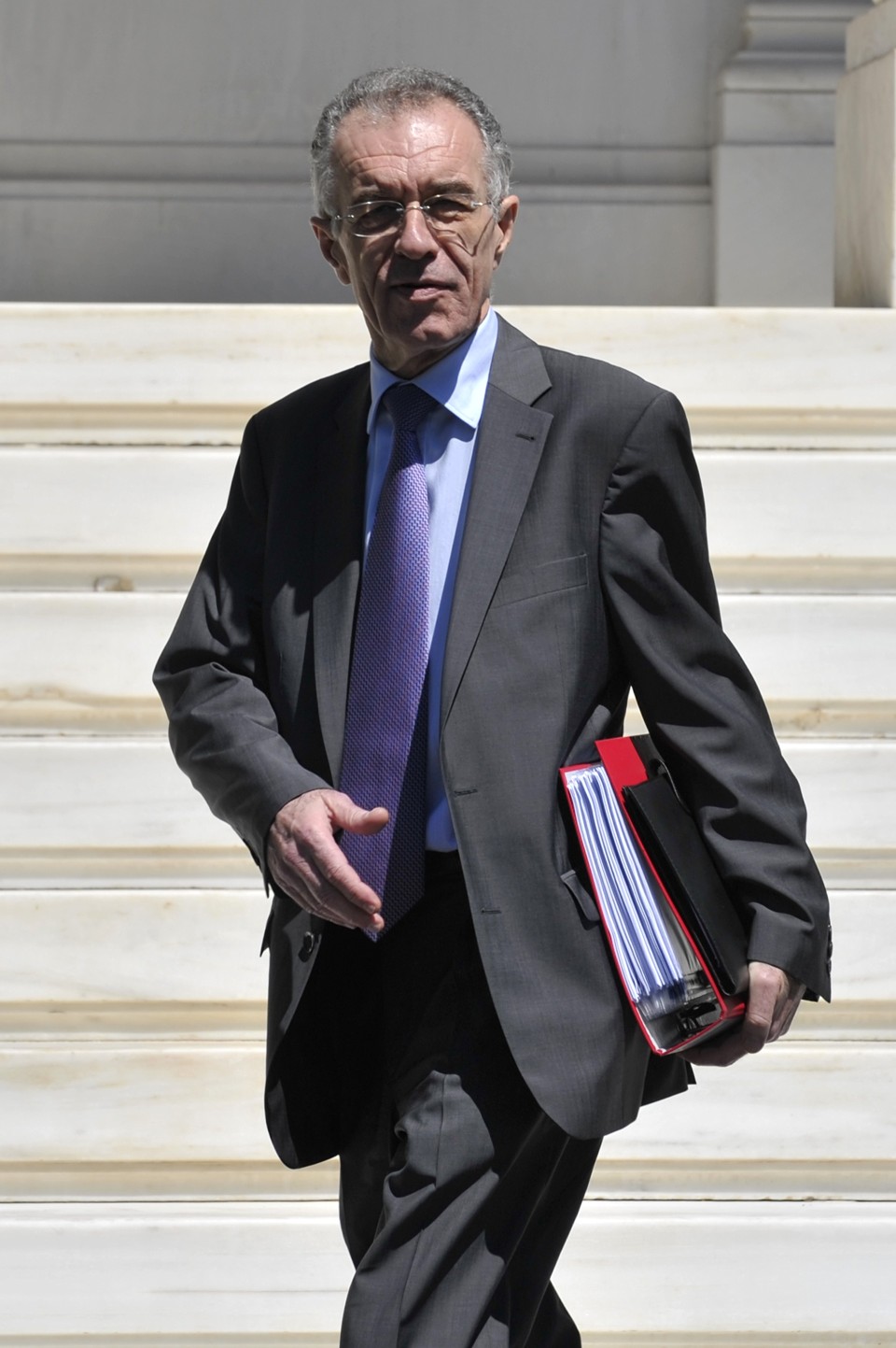 Vassilis Rapanos, ministro das Finanças da Grécia, que renunciou ao cargo alegando problemas de saúde | Louisa Gouliamaki/AFP Photo