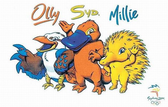 Além serem animais nativos da Austrália, a Kookaburra Ollie, o ornitorrinco Syd e a equidna Millie (corruptelas de Olimpíadas, Sidney e Milênio), mascotes de Sydney 2000, representam a terra, o ar e a água | 