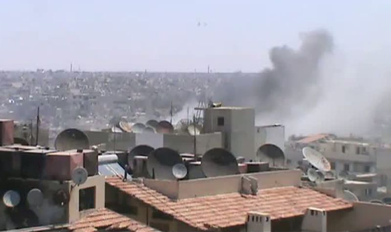 Imagem do YouTube mostra destruição causada por bombardeios em Homs, na Síria | AFP PHOTO/YOUTUBE