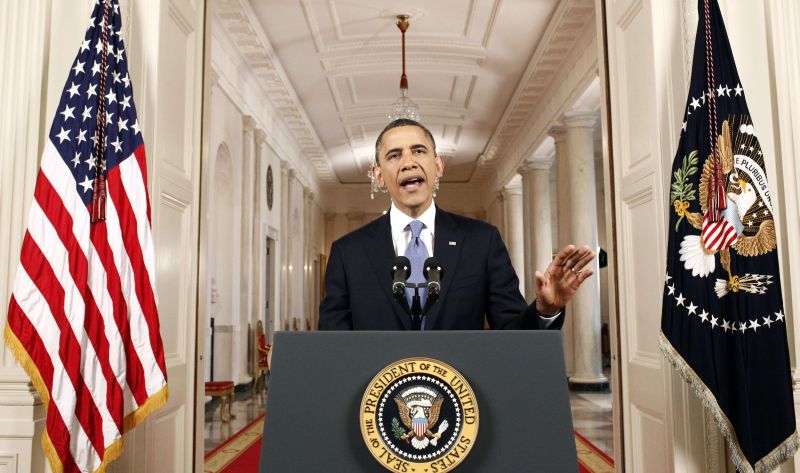 "Independentemente da política, a decisão de hoje foi uma vitória para o povo deste país, cujas vidas estão seguras por causa dessa lei e da decisão da Suprema Corte que a apoia", declarou Obama | AFP PHOTO/POOL/Luke Sharrett