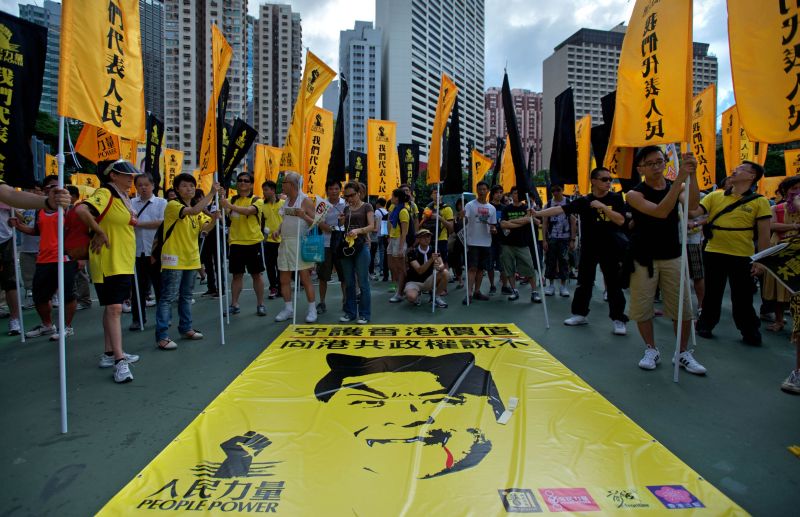 Manifestantes colocaram chifres no líder chinês | Alex Ogle/AFP