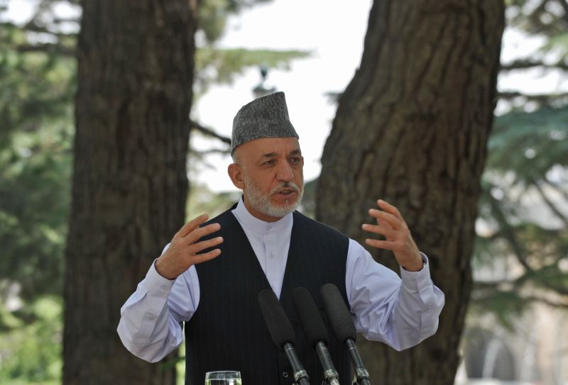 Presidente afegão Hamid Karzai fala durante coletiva de imprensa em Cabul | AFP PHOTO/ Massoud HOSSAINI
