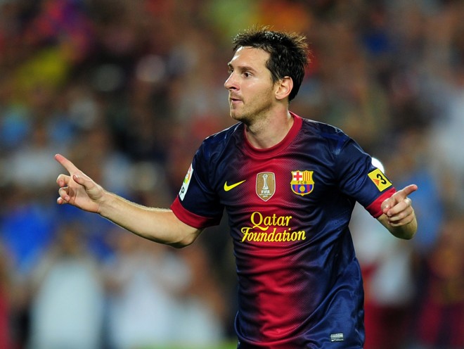 Jogador argentino Lionel Messi comemora após gol marcado em jogo contra o Real Madrid | AFP PHOTO/ LLUIS GENE