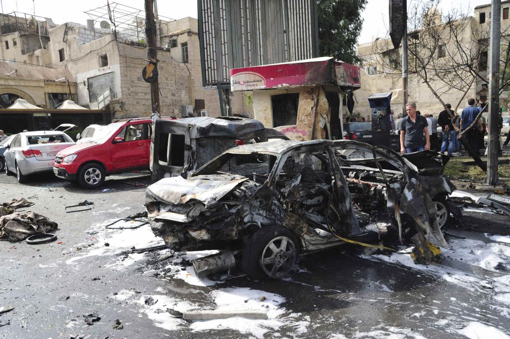 Carro bomba explode e mata 13 pessoas em Damasco | Sana / Reuters