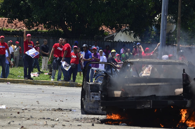 Há duas semanas, partidários de Chávez e Capriles se enfrentaram na cidade de Puerto Cabello | Reuters