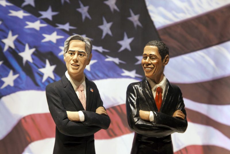 Figuras mostram os candidatos
Mitt Romney e Barack Obama | Carlo Hermann/ AFP