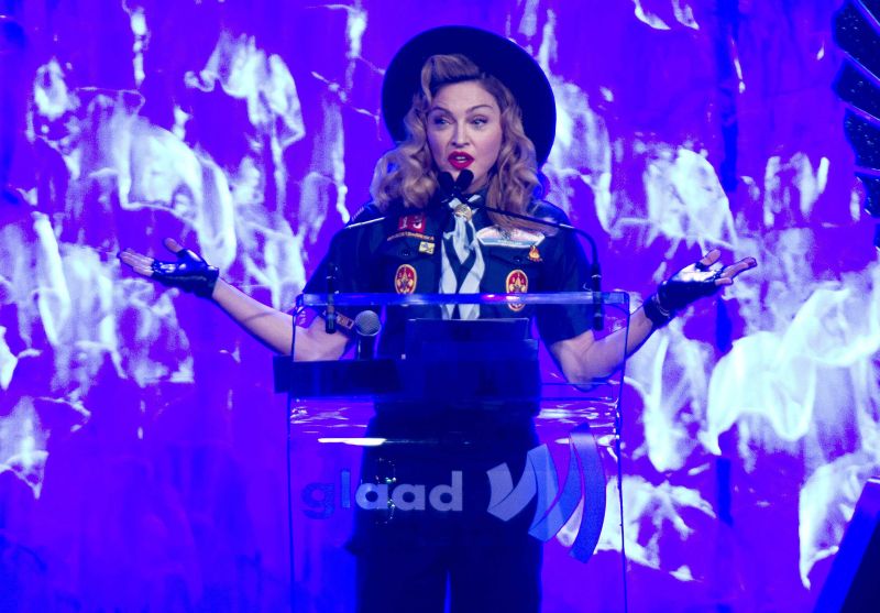 Madonna vestida como um escoteiro | REUTERS/Carlo Allegri