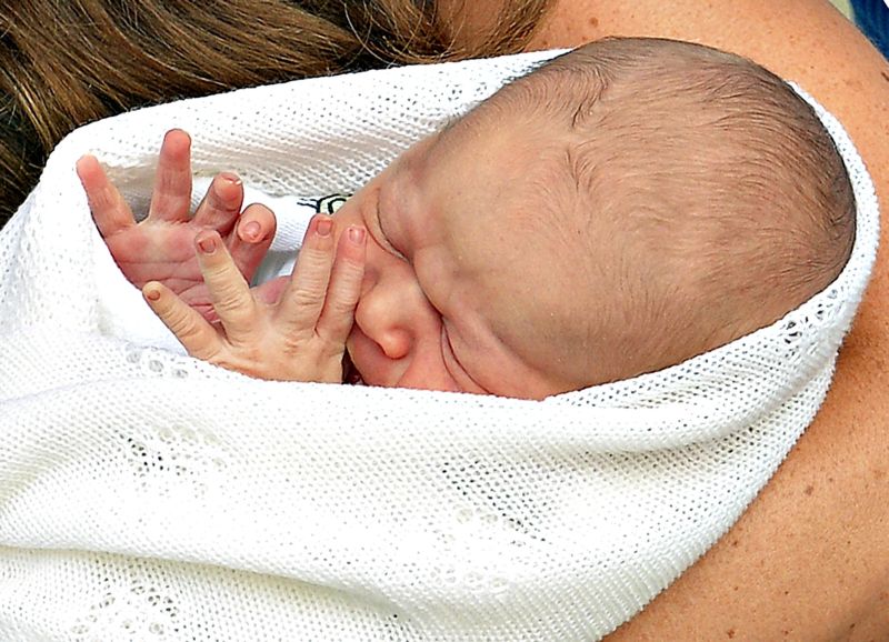 George Alexander Louis, o príncipe de Cambridge, na sua primeira aparição pública | John Stillwell/Reuters