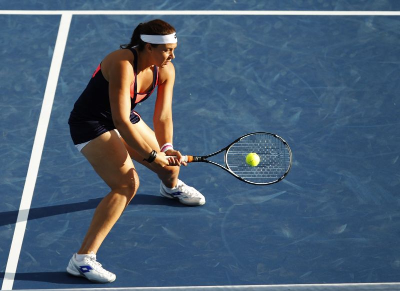 Marion Bartoli em sua última partida no circuito profissional, contra Simona Halep, em Cincinatti | John Sommers II / Reuters