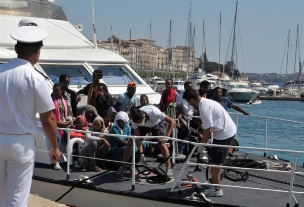 Um grupo de refugiados africanos chegaram ao porto de Siracusa, na ilha italiana da Sicília, em 7 de agosto de 2013 | Valentino Climi/EFE