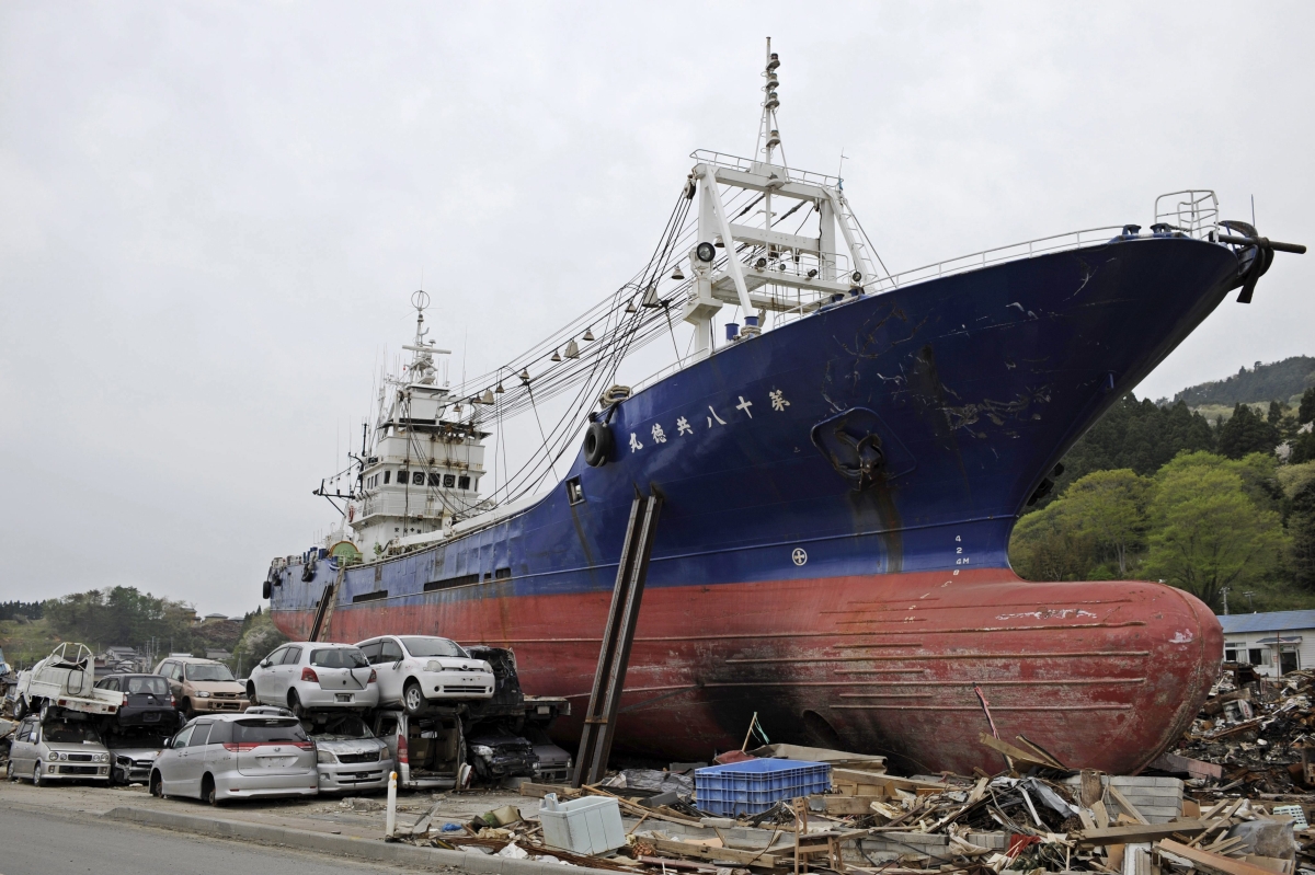 Foto de 2011 mostra a situação do local logo após o tsunami | EFE/Franck Robichon