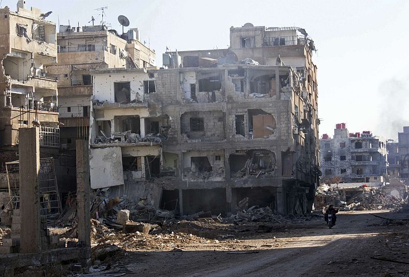 Prédios danificados em Daraya, perto de Damasco | REUTERS / Hussam Zeen