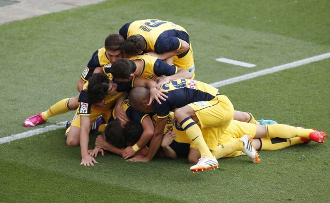 Jogadores do Atletico de Madrid comemoram gol de Godín | Gustau Nacarino/Reuters
