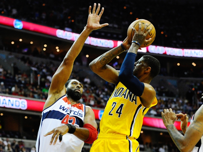 Paul George (de amarelo) foi o destaque do Pacers na vitória sobre o Wizards | Brad Mills / USA Today Sports