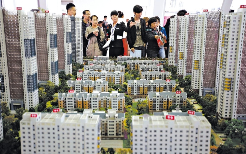 Mercado imobiliário emperra na China Construção civil representa um nono de toda a produção econômica da China; modelos de apartamentos em Shenyang | Sheng Li/Reuters