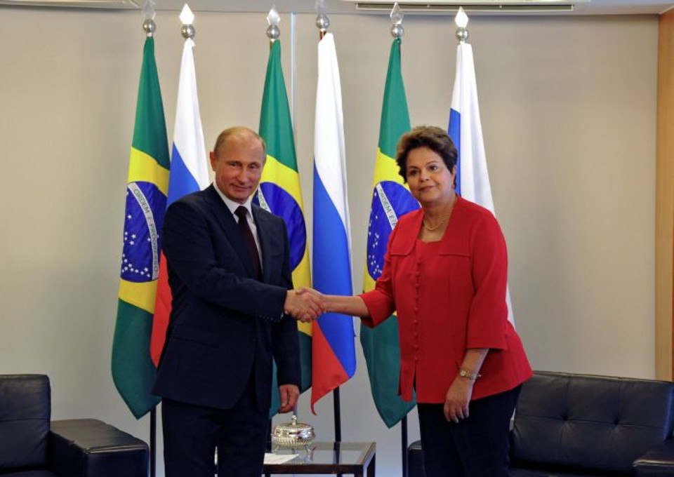 Vladimir Putin fez elogios à organização da Copa no encontro com a presidente Dilma Rousseff | EFE