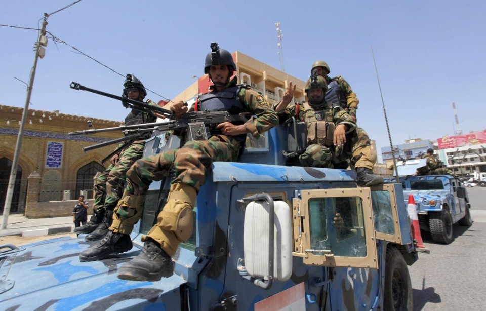 Soldados iraquianos de prontidão em Najaf | REUTERS/Alaa Al-Marjani