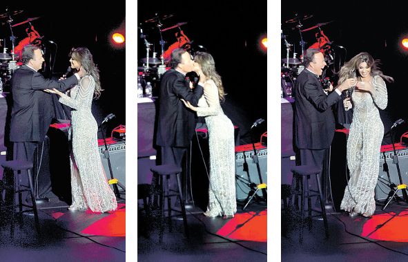 A baiana Vina Calmon, 26 anos, vocalista da banda Cheiro de Amor, causou inveja às fãs ardorosas de Julio Iglesias ao ganhar um beijo na boca durante sua participação especial no show de quarta-feira no Guairão. Depois da cena, Vina se abanou com as mãos | Fotos: Gustavo Garrett