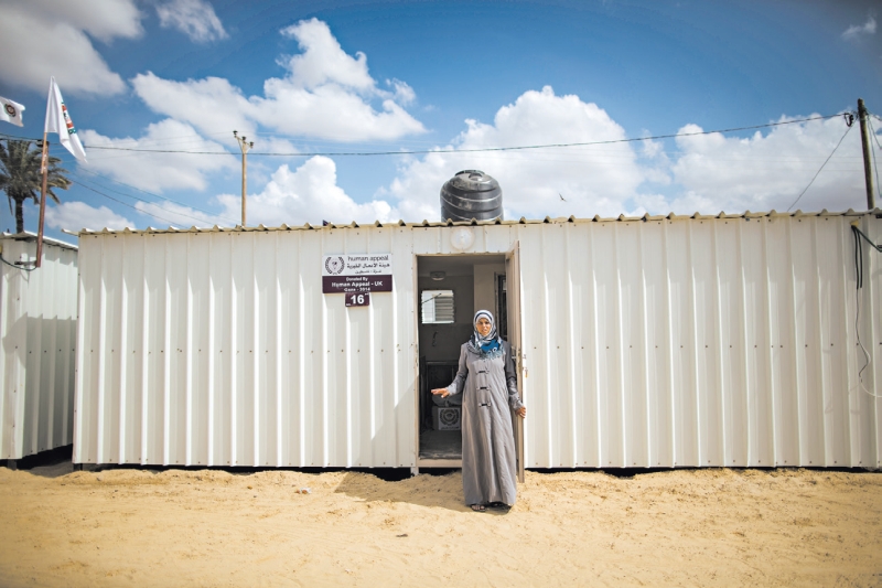 Mais da metade das três mil casas de Khuzaa foi destruída ou danificada. Nedaa Najjar vividas em trailers | Wissam Nassar /The New York Times