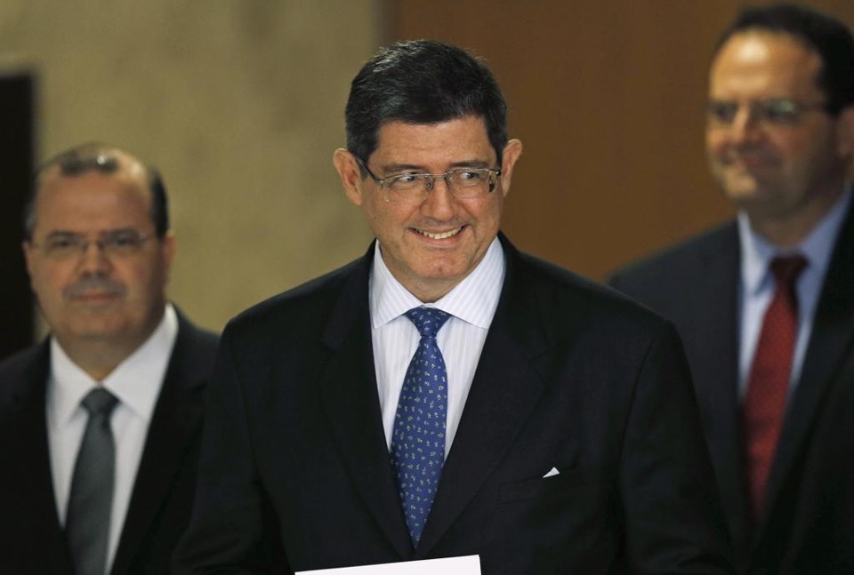 Joaquim Levy, com Alexandre Tombini e Nelson Barbosa: estrela do ministro da Fazenda é a que mais brilha na equipe econômica. | Ueslei Marcelino/Reuters