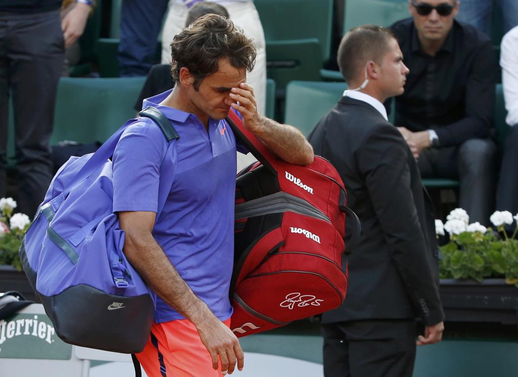 Federer foi derrotado por Wawrinka por 3 sets a 0. | VINCENT KESSLER/REUTERS