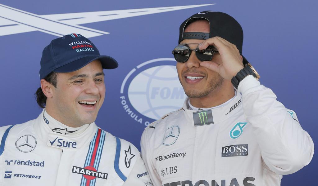 Felipe Massa ao lado do pole position Lewis Hamilton. | Phil Noble/EFE