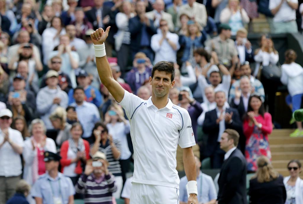 Djokovic garantiu vaga na semifinal ade Wimbledon ao vencer o croata Cilic. | Suzanne Plunkett/Reuters