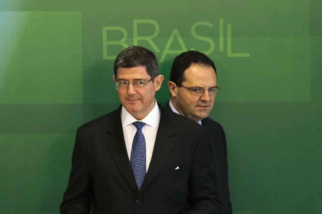 Joaquim Levy (à esquerda), vinha perdendo espaço para o colega Nelson Barbosa (à direita) em decisões envolvendo a política econômica do governo | UESLEI MARCELINO/REUTERS